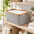 Medium light grey linen basket with bamboo rim on laundry shelving