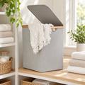 Linen / Laundry Basket with Lid - Light Grey in a bright laundry setting