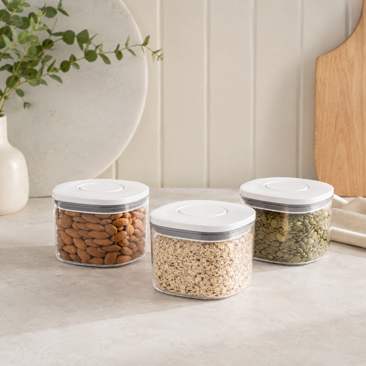 Three individual 500ml push top pantry containers with white lids displayed together