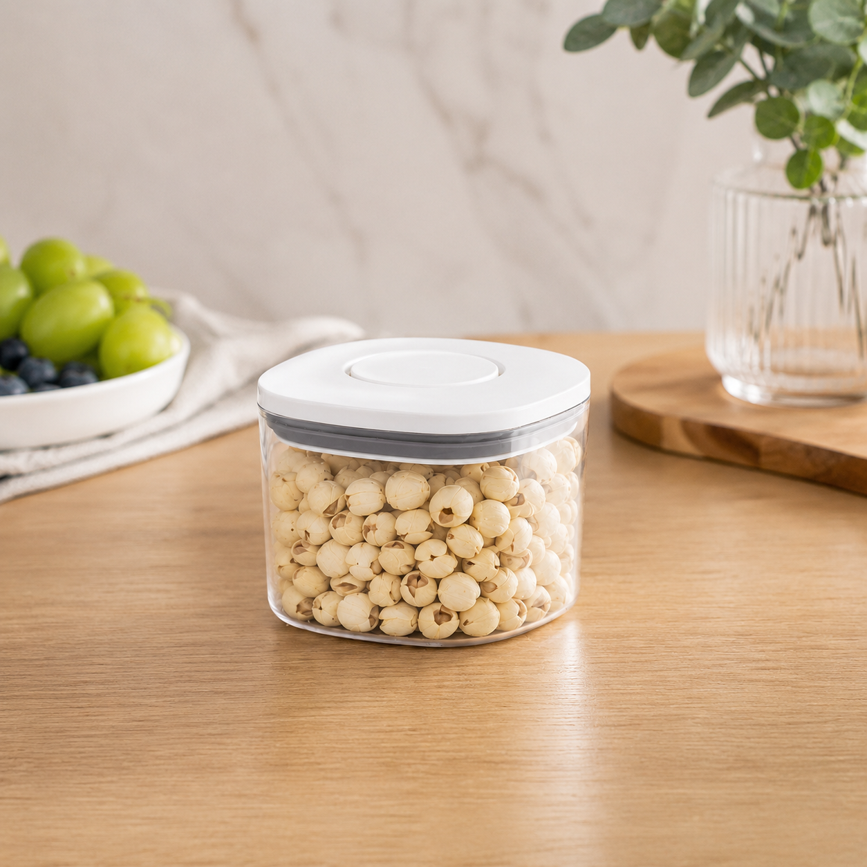 Clear 500ml push top pantry container with a white lid displayed on a wooden table