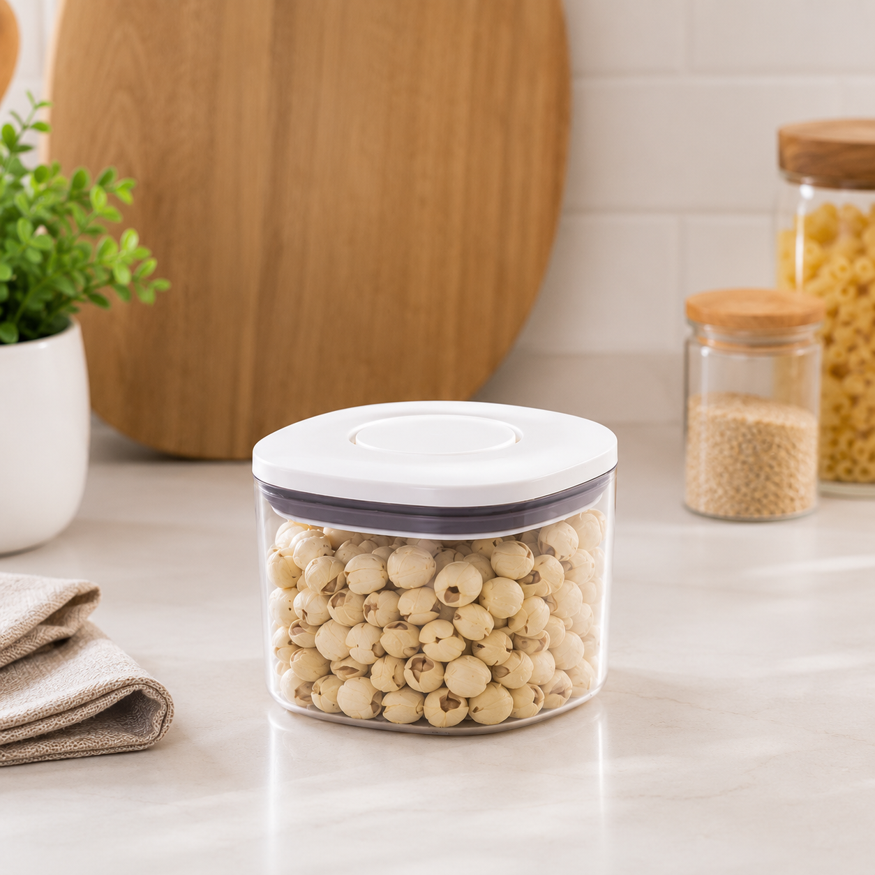 Clear 500ml push top pantry container with a white lid filled with dried ingredients